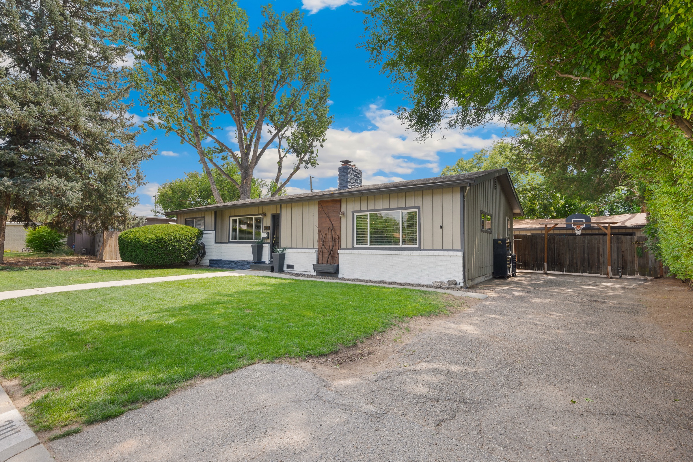 2111 South Broadmoor Drive at twilight under mature trees