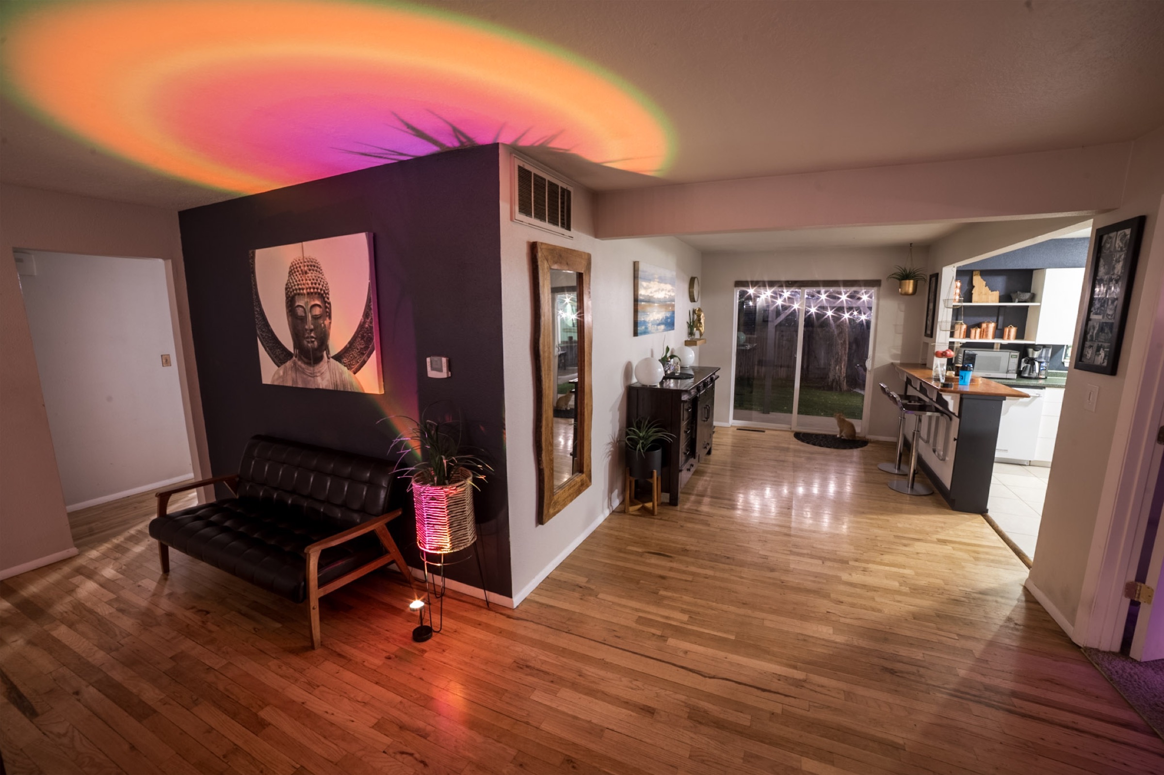 Detached studio with jewel-toned lighting and creative work zones